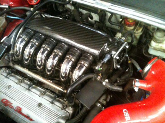 Alfa V6 ACT plenum fitted, see our carbon fibre factory for more info Alfa V6 Plenum